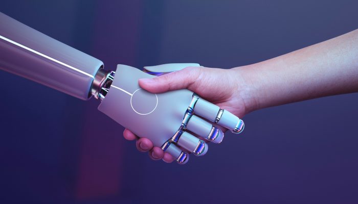 uścisk dłoni człowieka i robota
